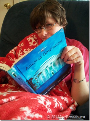 reading teen Swaddled in Government Class